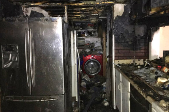 Burn damage in kitchen and laundry home following a structure fire