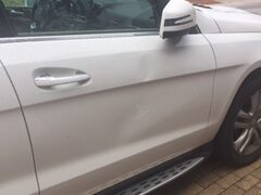 Damage to passenger side door of a victim