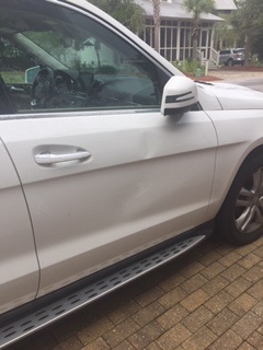 White SUV Door with Dent