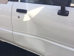 Damage to the passenger side door of a victim