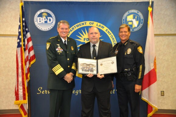 Sergeant Wayne Grandstaff poses with Escambia County Sheriff during Florida Leadership Academy graduation. 