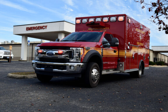 Red Walton County Fire Rescue Ambulance in Front of Hospital