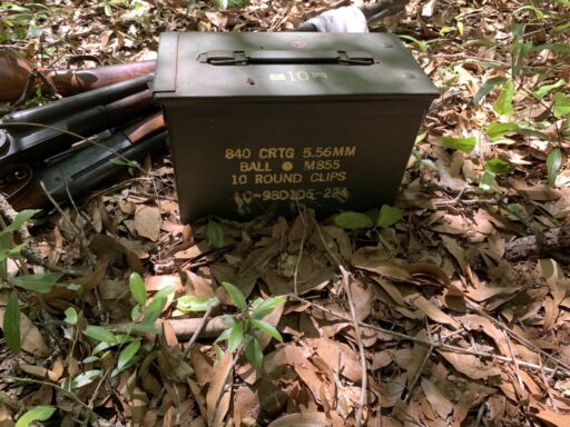 Firearms and an ammo can located in the woods following Spaid's arrest.