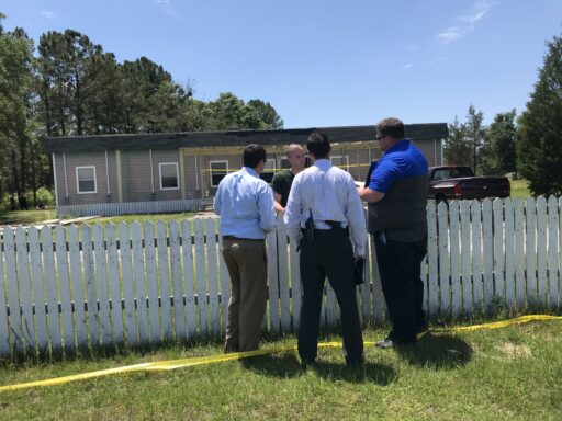 Investigators gather at the scene of a deputy involved shooting in Bruce.