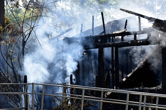 Smoke coming from home after structure fire