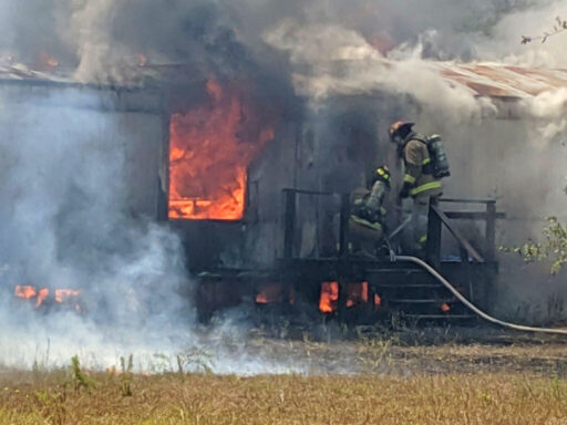 Firefighters Entering Mobile Home On Fire