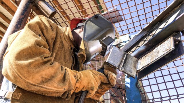An inmate at the Walton County Jail is pictured welding a piece of steel during the flux core welding class. 