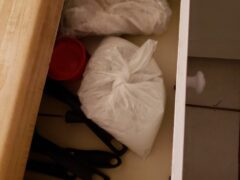 DRUGS BEING LOCATED IN A DRAWER