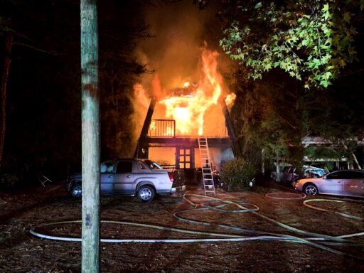 Three story home fully engulfed in flames