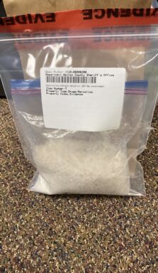 Bag of white unknown substance in an evidence bag.