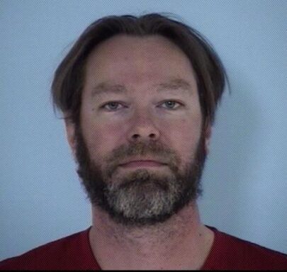 Mug shot of a white male with gray and brown facial hair