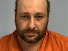 Mug shot of white male, balding with brown facial hair
