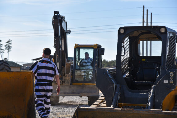 Inmates and heavy equipment
