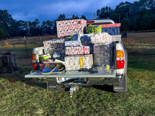 Christmas Presents stacked in the back of a silver truck