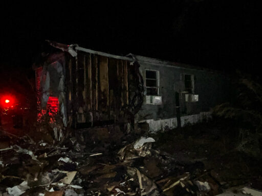 Back corner of mobile home missing from structure fire