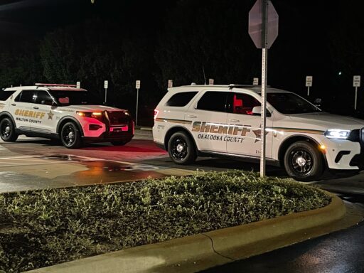 Deputy patrol cars from Walton County Sheriff's Office and Okaloosa County Sheriff's Office