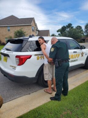 a white male being arrested by a deputy