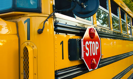 School bus with stop sign out