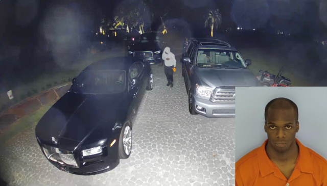 Picture of a black male wearing a gray hoodie and black pants standing in between cars in a driveway with an overlay of a picture of a mug shot of a black man wearing an orange jumpsuit