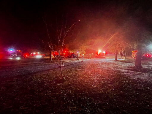 Fire engines with red lights at night