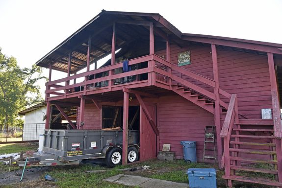 Large red barn with smoke and fire damage in apartment on top floor