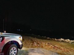 An FWC truck parked on a sandy beach on the choctawhatchee bay